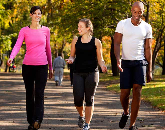 Group walking together in park outdoors