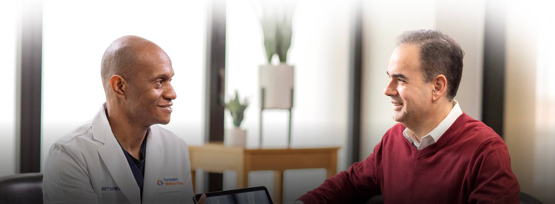 Doctor speaking with patient in office
