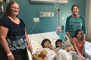 Jack with family in hospital room