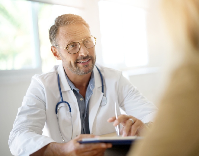 Healthcare provider consulting patient in office